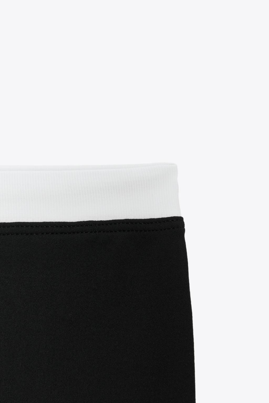 SPORTY DOUBLE EFFECT CROP TOP