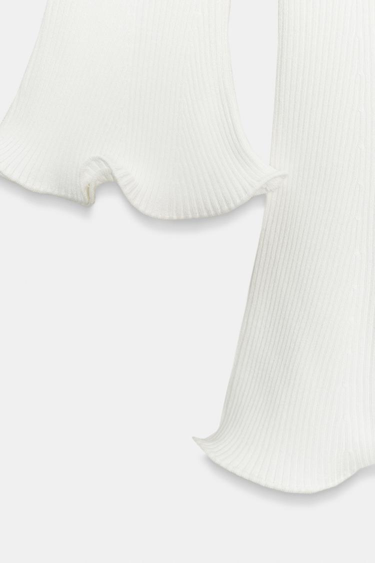 RIBBED KNIT DRESS WITH WAVY HEM